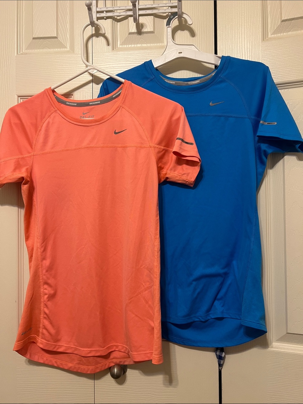 Two Nike running Short Sleeve Dri-FIT Tees in Coral and Royal Blue